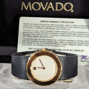 Movado Museum style ladies watch gold color w black rubber band
